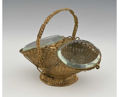 A French Palais Royal gilt metal wire and glass lidded double basket, woven form with ropetwist top handle, two hinged oval b
