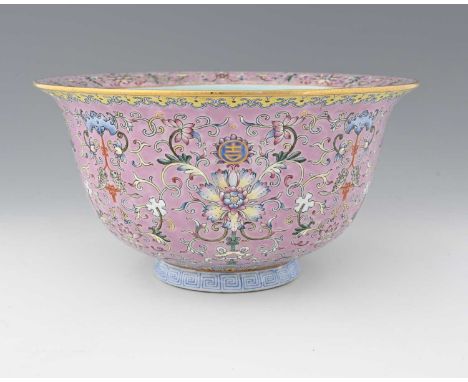 A Chinese famille rose jardiniere, Daoguang mark, pink ground, enamelled with foliate scroll design punctuated by lotus flowe