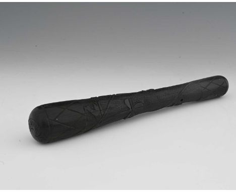An Irish carved bog oak shillelagh, short truncheon form modelled in relief with a vine of shamrocks, incised Killarney to th
