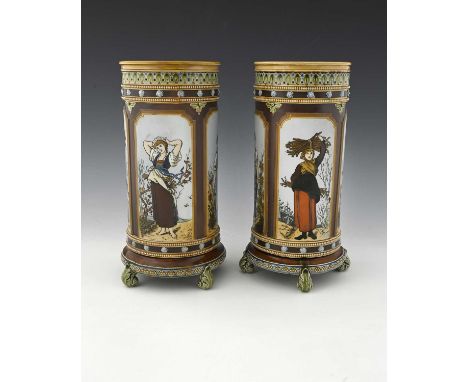 A pair of Art Nouveau Mettlach cylinder vases, late 19th/early 20th Century, decorated with panels representing the Four Seas