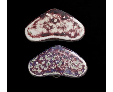 Ruskin Pottery, two High Fired heart shaped plaques, red sang de boeuf flambe, one with green oxide and purple speckles, both