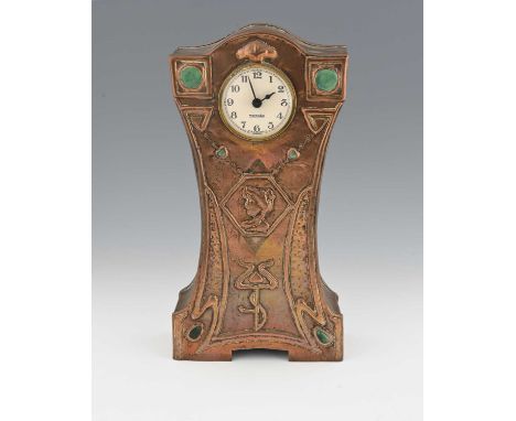 An Arts and Crafts copper and Ruskin set clock, waisted bracket form, repousse embossed with whiplash tendrils, stylised tuli