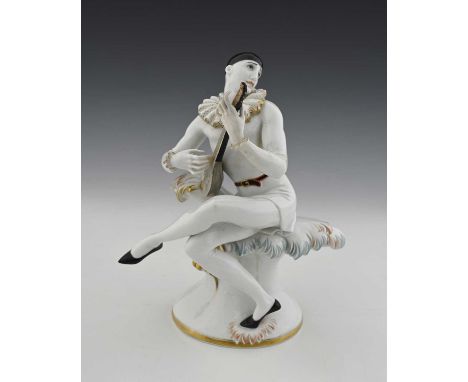 Theodor Karner for Rosenthal, an Art Deco figure of Pierrot, model 303, designed circa 1925, modelled playing a mandolin on a