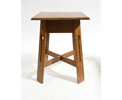 An Arts and Crafts oak occasional table, circa 1905, square moulded top on outstretched plank legs with stylised fretwork dev