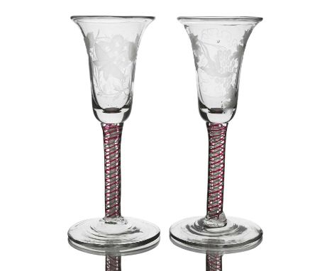 A matched pair of Dutch engraved colour twist wine glasses, the bell shaped bowls engraved with Jacobite style motifs includi