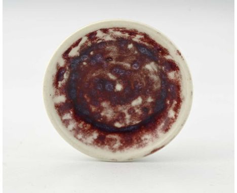 Ruskin Pottery, a small High fired dish, 1927, red and purple sang de boeuf over dove grey, impressed marks, 8cm diameter