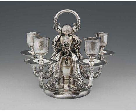 Georg Jensen, a Danish Skonvirke silver Grape pattern five branch candelabrum, model 383A, designed circa 1915, post-1945 mar