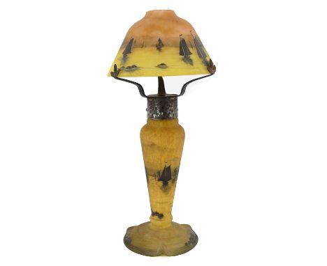 Daum, an Art Nouveau enamelled cameo engraved pate de verre glass lamp, the conical domed shade with a coastal marine scape o