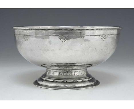 Guild of Handicraft, an Arts and Crafts silver bowl, London 1929, footed form, planished and incised with band and scale moti