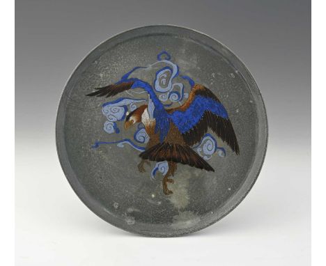 A Doulton Titanium ware tazza, decorated with a bird in flight, 23cm diameter