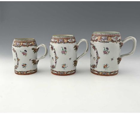 A graduated set of three Chinese export famille rose tankards, in the Cantonese style, conical rimmed cylinder form painted w