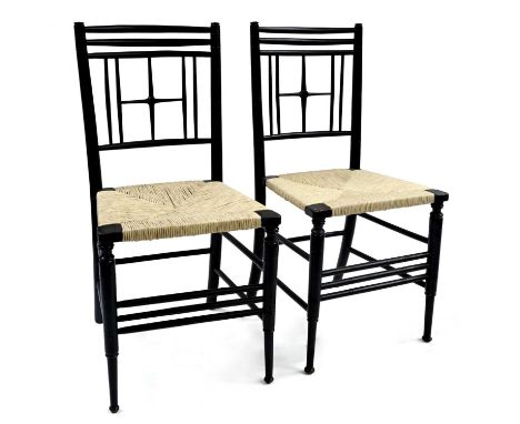 Liberty and Co, a pair of Arts and Crafts Argyle chairs, 1874 after Ford Madox Brown for William Morris' Sussex chairs, cruci