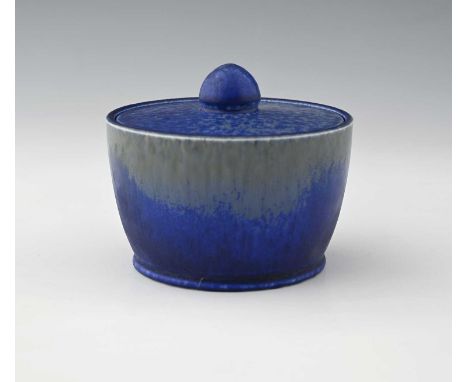 Ruskin Pottery, a Crystalline glazed pot and cover, circa 1930, circular form with bun finial, blue matt over grey gloss, imp