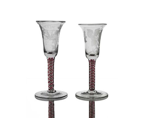 A matched pair of Dutch engraved colour twist wine glasses, the bell shaped bowls engraved with Jacobite style motifs includi