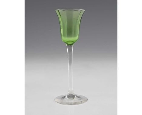 Koloman Moser for E Bakalowits and Sons, a Secessionist green and colourless liqueur glass, Vienna circa 1900, the vertically