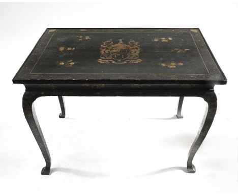 A George I black japanned side table, circa 1720, rectangular tray top with central heraldry contained within a trailing vine
