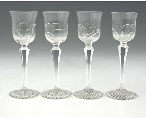 Thomas Webb, a set of four Edwardian intaglio cut rock crystal glass liqueur glasses, circa 1905, the tulip form bowls with s