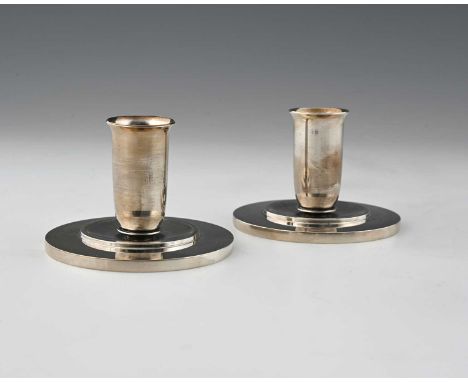 Harald Nielsen for Georg Jensen, a pair of Art Deco silver candlesticks, model 748, the flared beaker form sconces on slightl