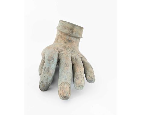 A large green patinated bronze hand sculpture, from an Indian deity, finger, and thumb in the 'out' position, 32cm high, 48cm
