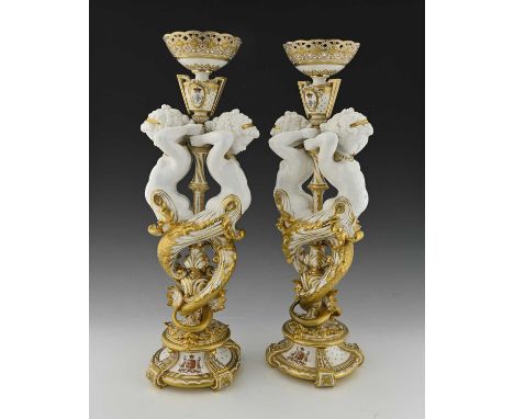 Minton for Thomas Goode, large pair of figural table centrepieces, circa 1876, the central acanthus baluster stem entwined wi