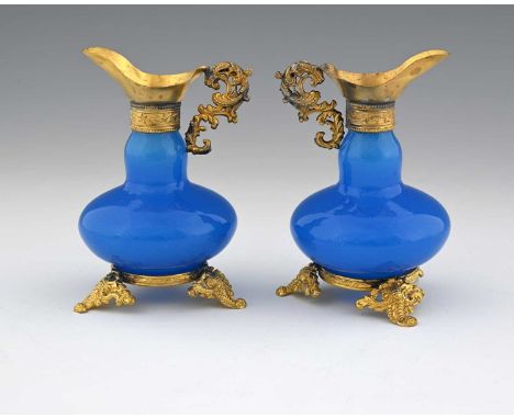 A pair of French Palais Royal opaline glass and gilt metal mounted ewers, probably Baccarat, 19th century, gourd form blue op