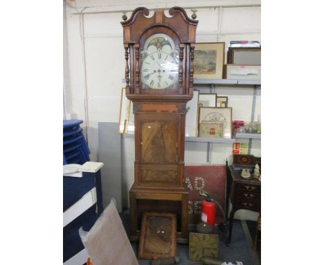 A Georgian mahogany long case clock having an arch topped dial with an 8-day movement with pendulum and weights 