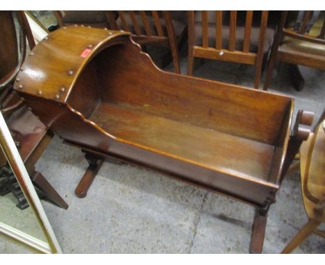 A walnut hooded cradle circa 1790 on T shaped original stand with bobbin turned stretcher, 32" h, 36 1/2"w 