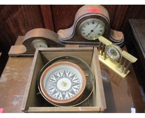 A vintage compass in treen box and a selection of mantle clocks 