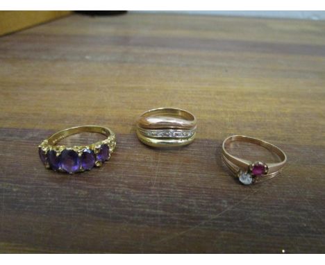 Three gold rings to include a 9ct gold five graduated amethyst stone ring, a 585 14K rose gold ring set with a red gem stone,