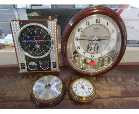 A Small World Rhythm Clock, a Spirit of St Louis Clock, a barometer and another clock 