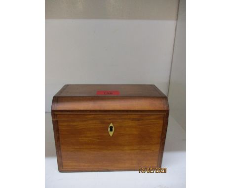 An early 20th century walnut tea caddy 