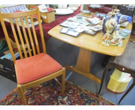 An Ercol blonde elm extending dining table, 29" h x 60"w and a set of six slat back dining chairs 