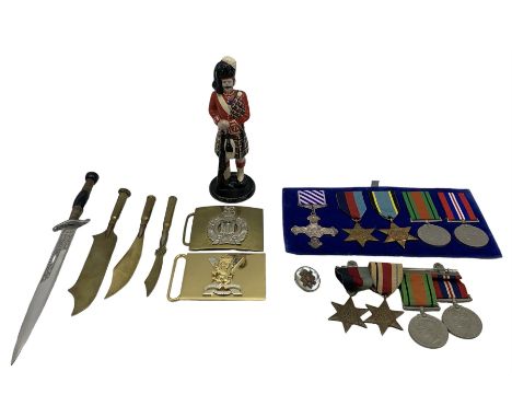Group of four WWII medals including War Medal, Defence Medal, Africa Star and 1939-1945 Star, group of five medals with repro