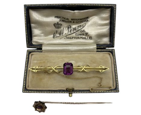 Purple paste bar brooch, stamped 9ct, and a ruby stick pin (2)Condition Report:Approx 5.2gm gross, bar brooch 6cm long, stick
