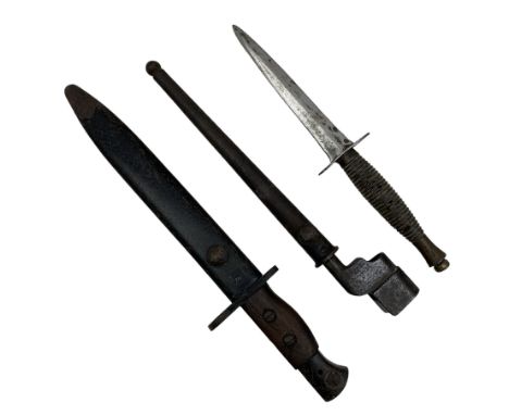 British No.5 Jungle Carbine bayonet by Wilkinson Sword Co. with fullered blade and two piece wooden grip in scabbard overall 