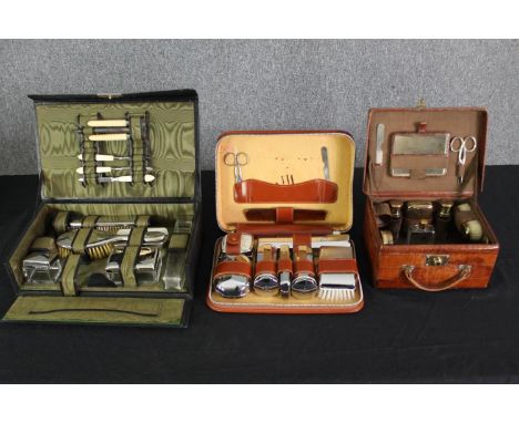 Three vintage mid 20th century travelling dressing table sets, H.8 W.30 D.19cm. (largest). 