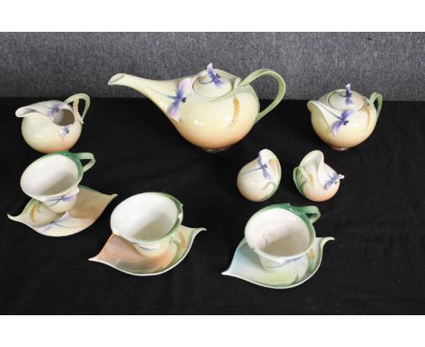 A Franz porcelain part tea service, decorated with dragonflies. H.13 W.28 D.13cm. (largest). 