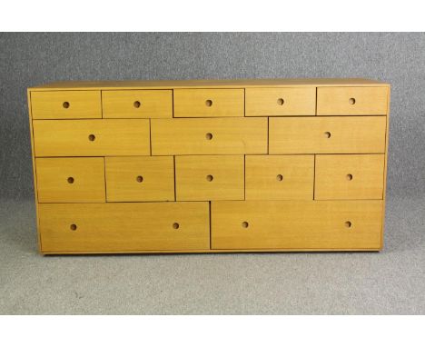 A contemporary light oak chest of drawers, H.73 W.150 D.48cm. 