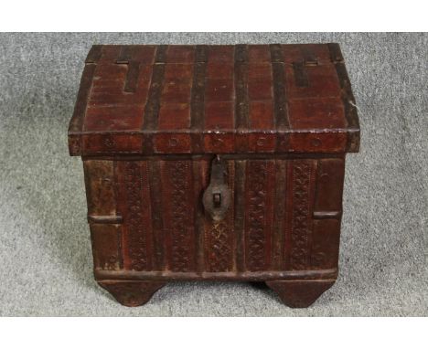 A small painted and metal bound Indian trunk. H.35 W.43 D.33cm. 