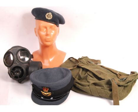 A collection of assorted militaria items to include: a contemporary gas mask, a 1990's WRAF uniform hat, a vintage WWII coppe