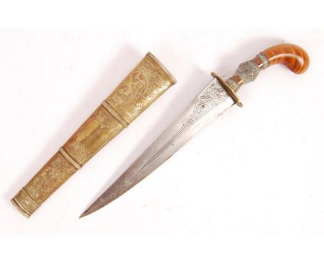 A 19th / 20th century&nbsp;Mindanao Filipino Gunong / Puñal (Punyal) de kris having a wooden curved hilt with a heavily decor