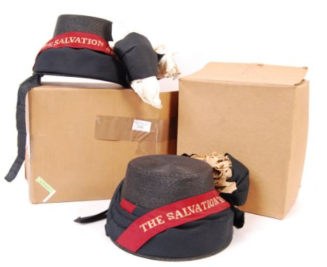 A pair of vintage mid 20th century ex stores Salvation Army uniform bonnets having The Salvation Army ribbon. Both in their o
