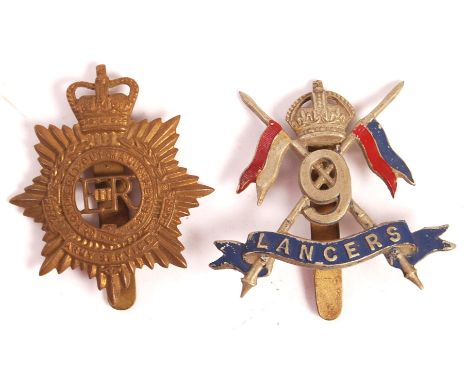 An original rare vintage 9th Queen's Royal Lancers uniform cap badge. Scarce painted example, with red and blue decoration. N