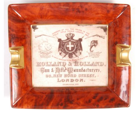 A rare 20th Century Holland and Holland advertising point of sale porcelain cigar / cigarette ashtray having a central panel 