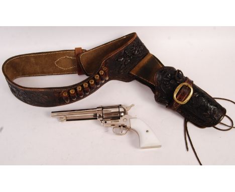 A set of 20th century Western / Wild West cowboy reenactment items to include:&nbsp; Leather tool worked gun holster belt wit