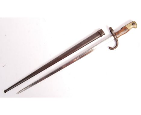 A French Model 1878 ' Gras ' Sword Bayonet. Marked to top of blade ' Mre d'Armes de St Etienne 1878 '. Within an original ste