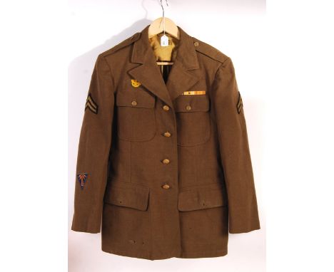 A WWII Second World War 1942 pattern US Army Air Service / USAAF uniform jacket. Insignia patches for a Communications Specia