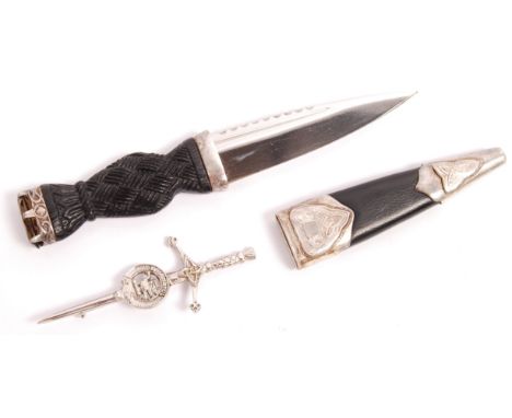 A vintage c1987 Silver mounted Scottish dirk dagger of small proportions having a carved and ebonised wooden knot form handle