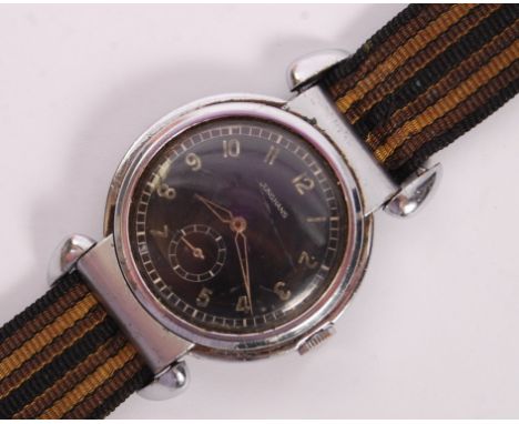 A WWII Second World War era 1940's German made ' Junghans ' pilot's wrist watch. Black enamel dial with arabic numerals, and 