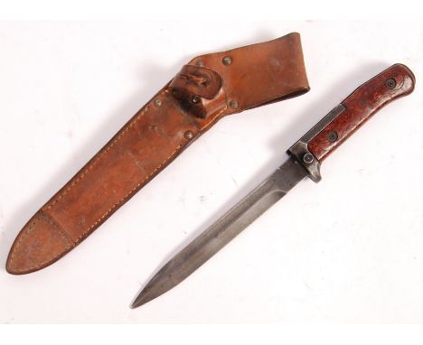 A post WWII Second World War Vietnam War Czech VZ57 rifle bayonet having compressed wood chip grip, push button knuckle guard